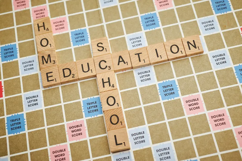 Wooden letter tiles on a board spelling out words